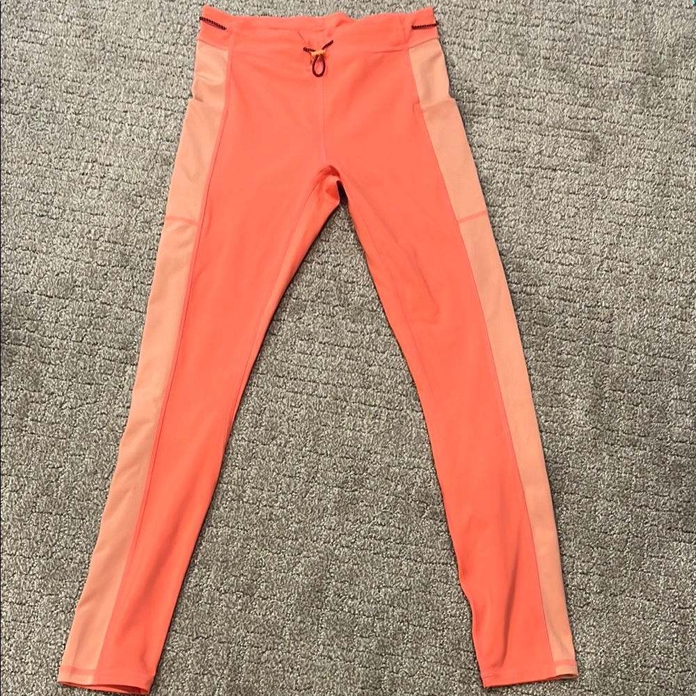 Orange/coral Fabletics Athletic Leggings with Two-Tone Panels